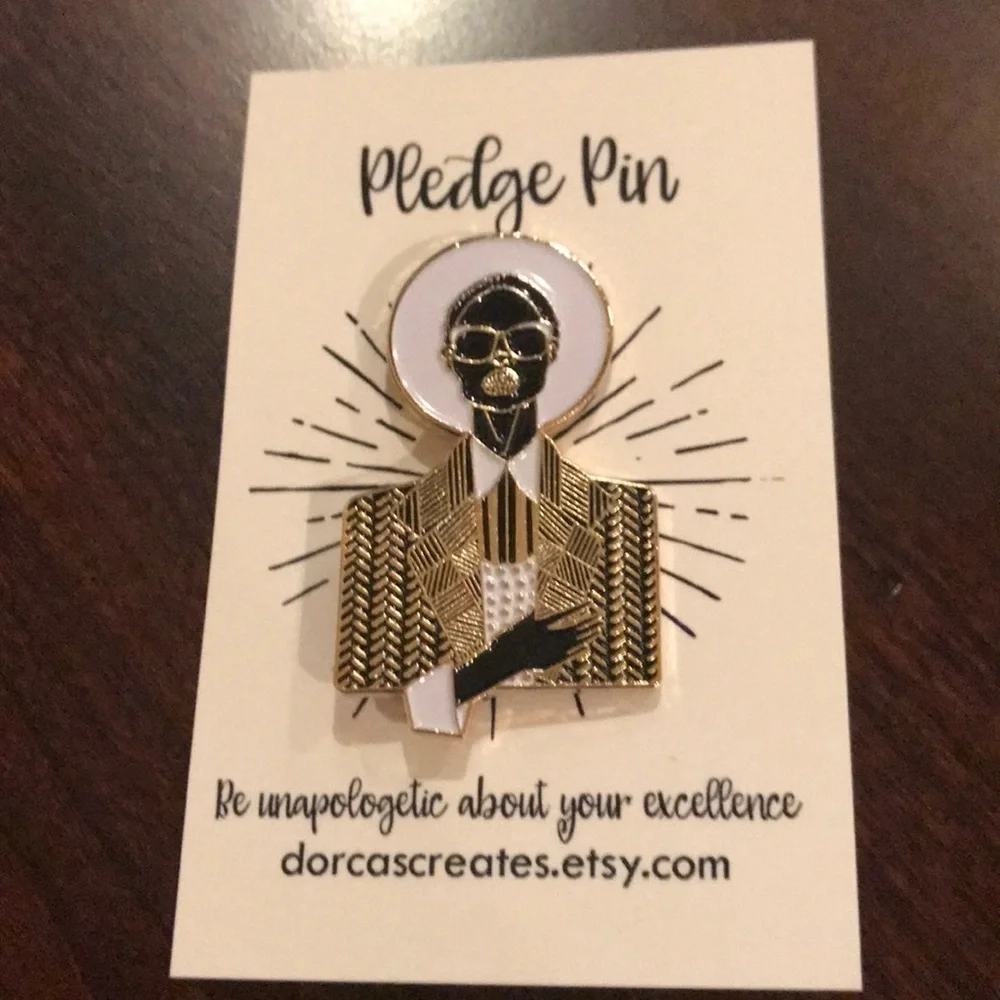 Gorgeous gold, black, and white pledge lapel pin.